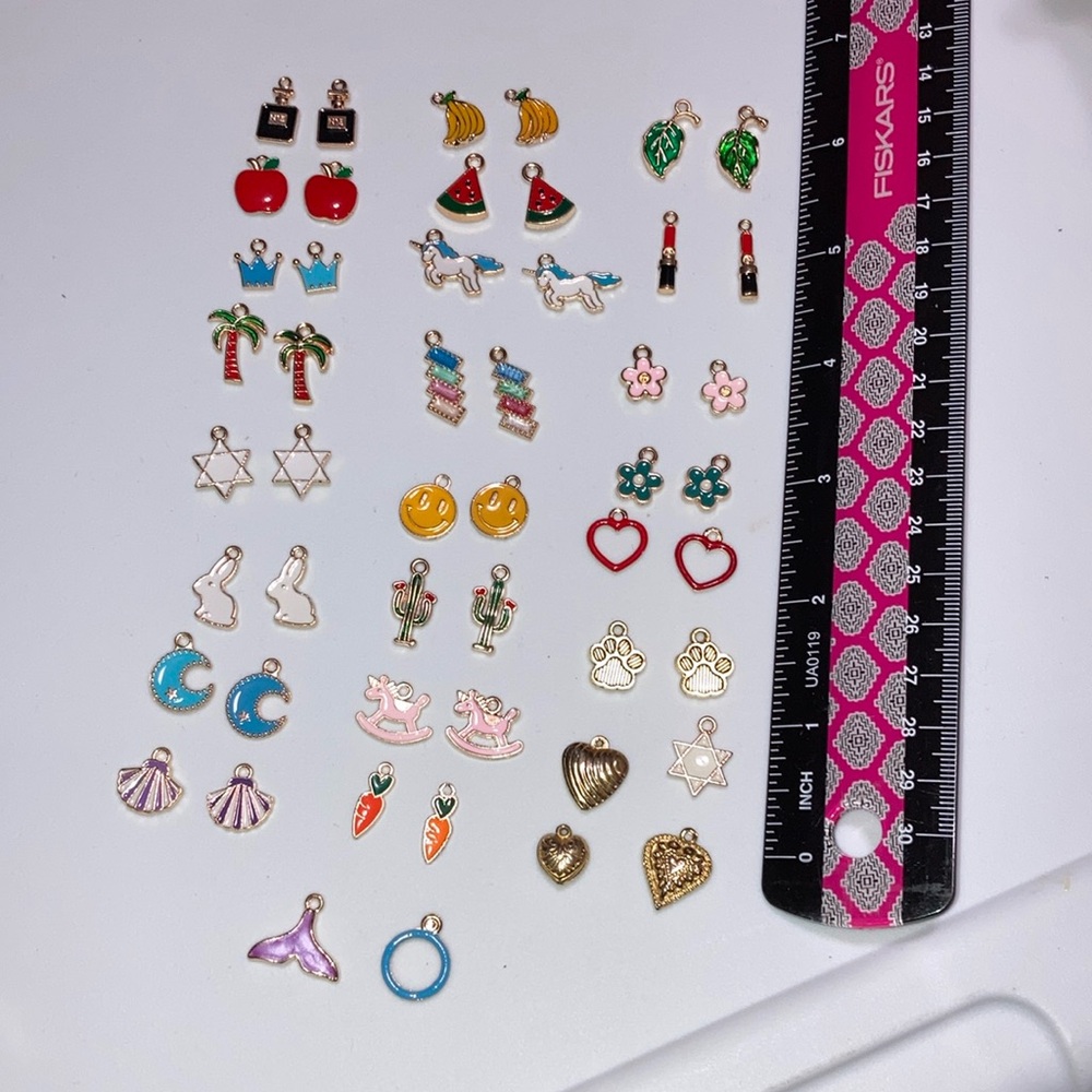 Assorted gold tone and enamel charms for jewelry